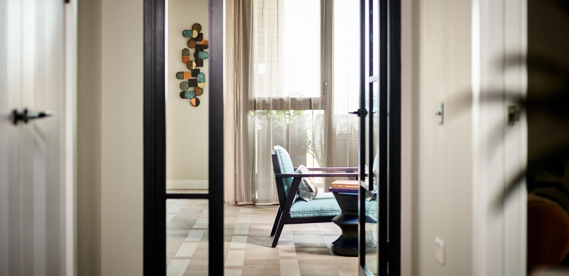 An interior Hallway image looking into the living / Kitchen / Dining area at Saffron Wharf