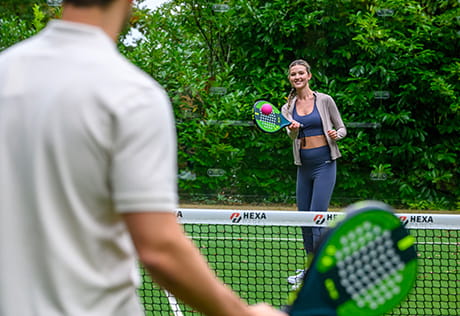 An image of a couple playing Padel