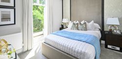 Double bedroom with neutral blue and grey design