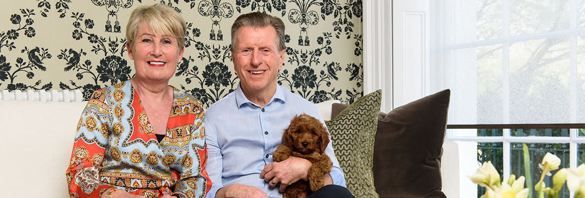 Jeff, Sheena and their puppy relaxing in their new Oakhill home