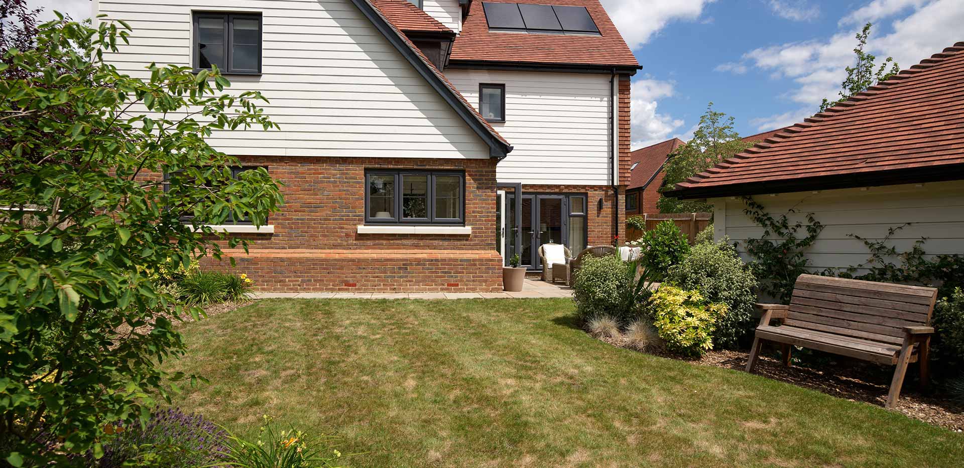 An image of the Garden looking towards the house at Oakhill Copse