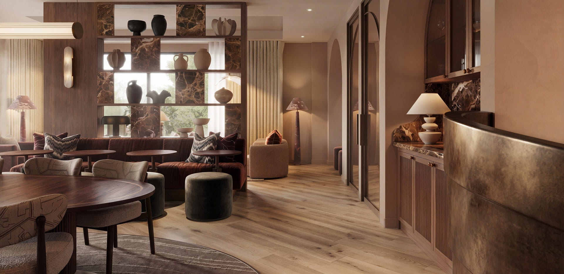 Lounge bar study area, ample seating, warm lighting, decorated in warm colours: browns and reds.