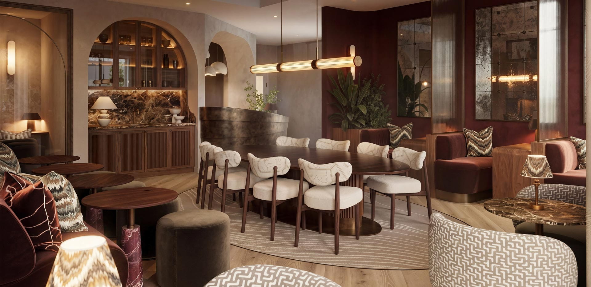 Lounge bar study area, ample seating, warm lighting, decorated in warm colours: browns and reds.