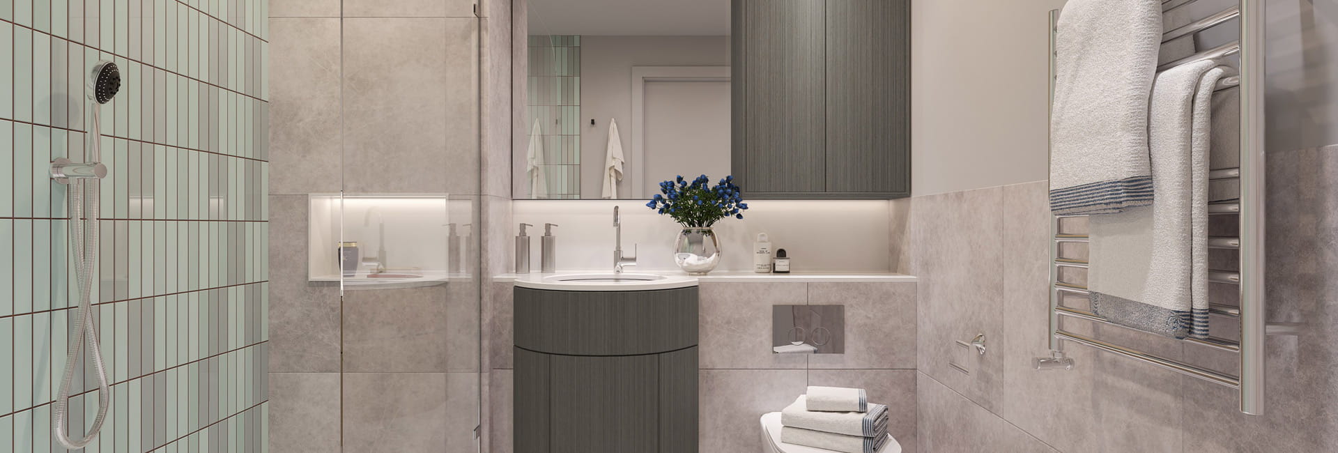 Modern designed bathroom with shower unit, wash basin with wall mirror, heated towel rack.