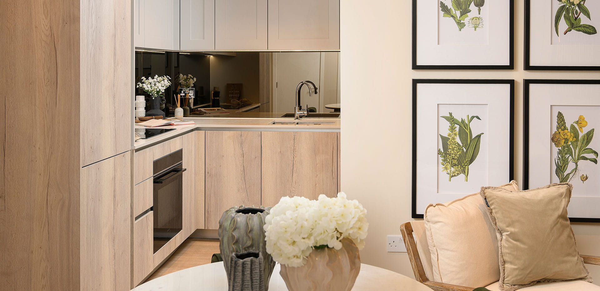 An image of a kitchen with a wooden style palette, with the dining area in the foreground