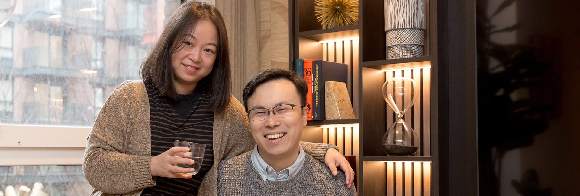 Junsheng and his wife in their apartment
