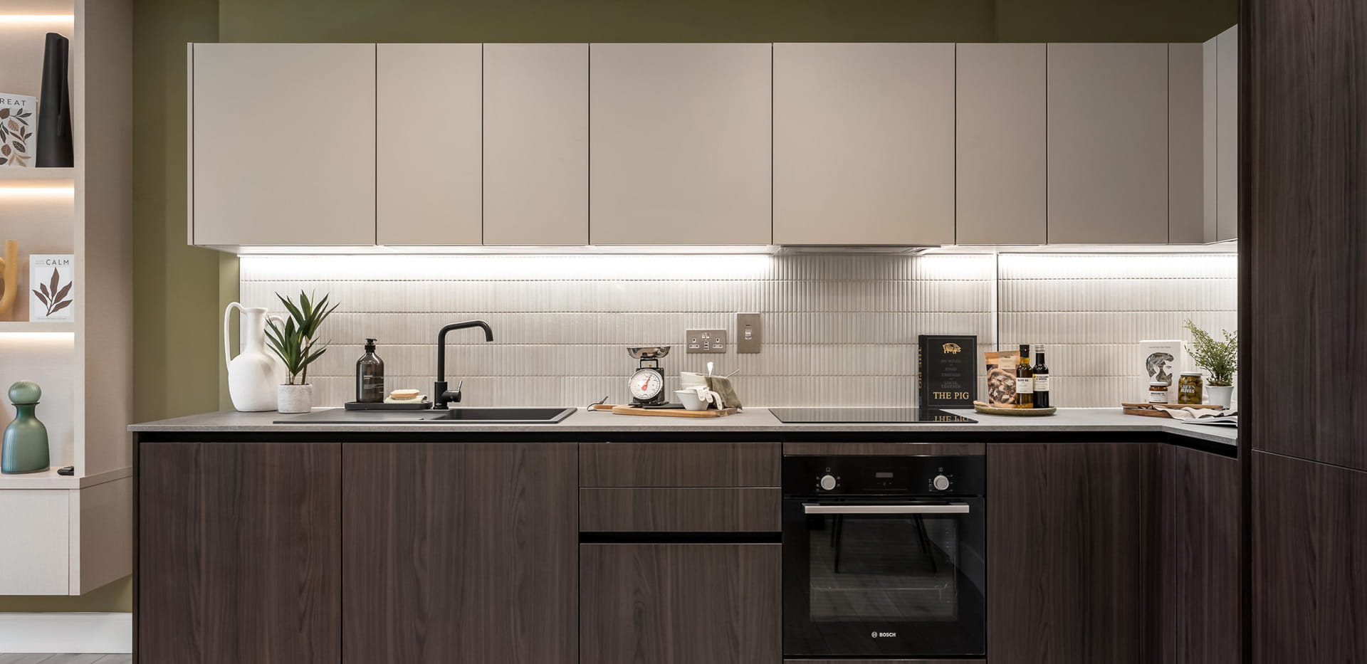 Kitchen with off-white and dark wood pattern cupboards