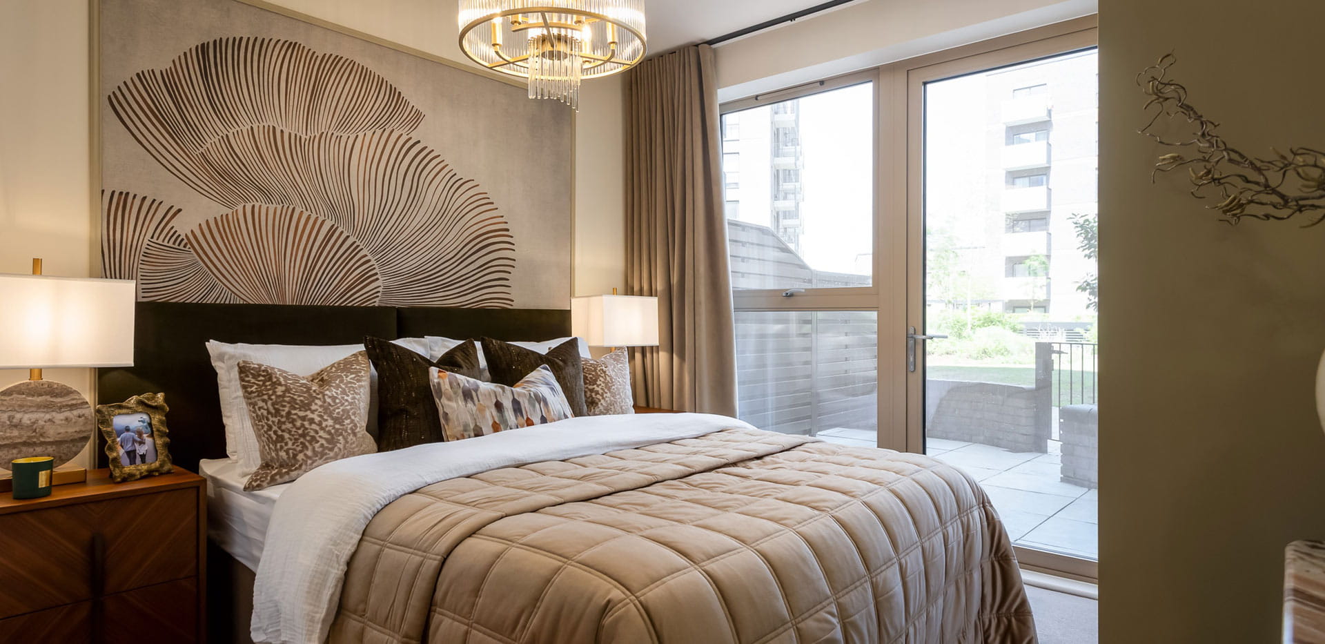 Bedroom with decorative wallpaper, beige colour palette