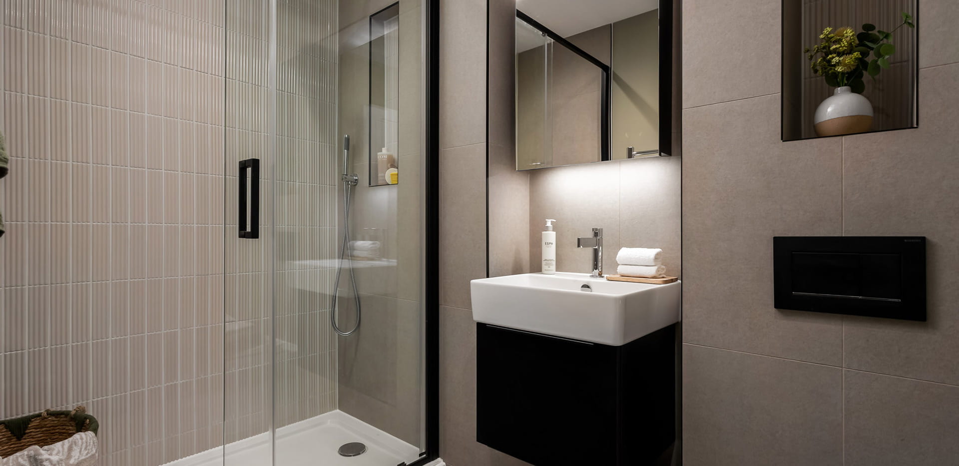 Shower unit, wash basin with wall mirror, toilet and cabinet space