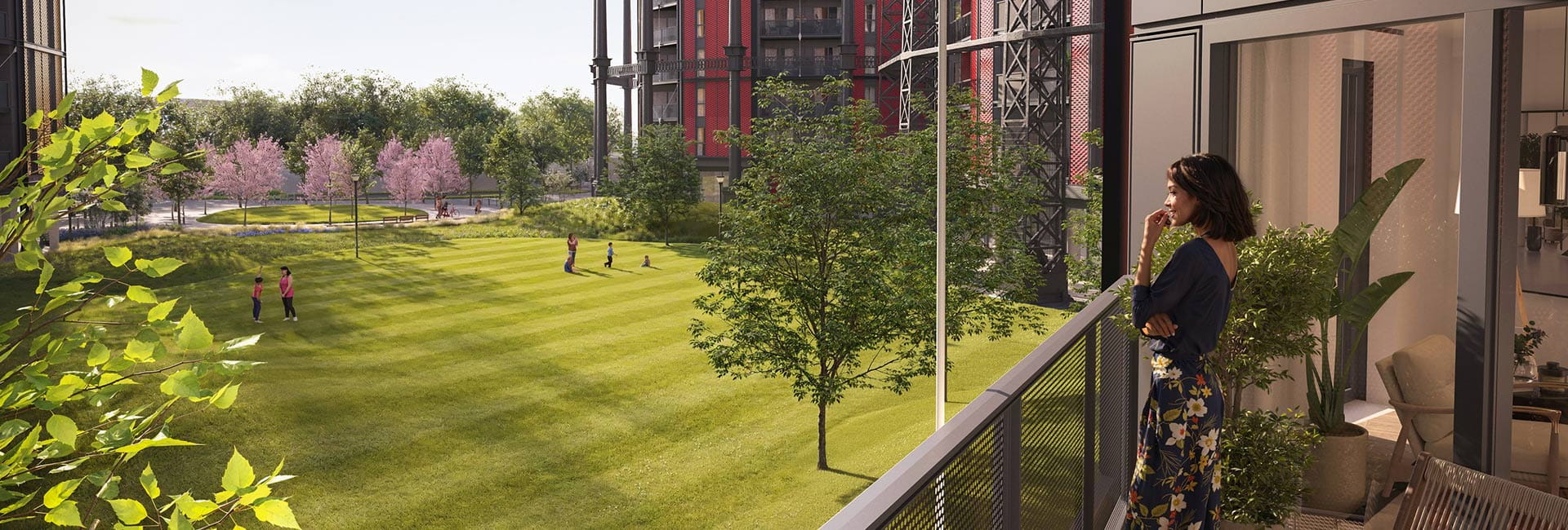 An image of a woman looking out over her balcony with stunning views of Regent View's green open spaces