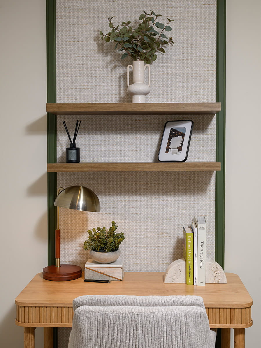 A desk with multiple shelves above.