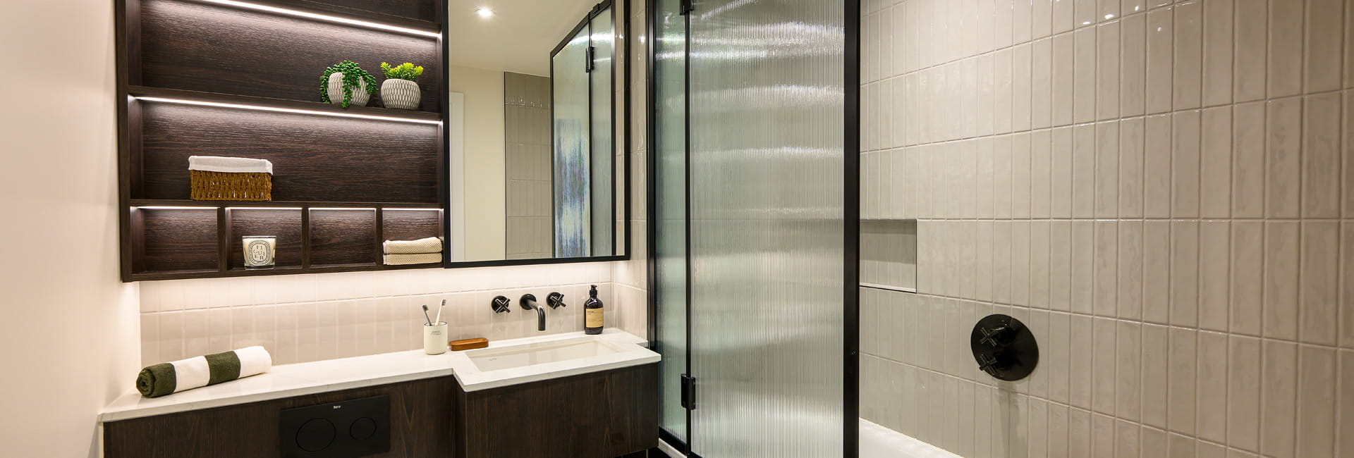 bath, wash basin with cabinet mirror and shelving, beige cream tiled walls