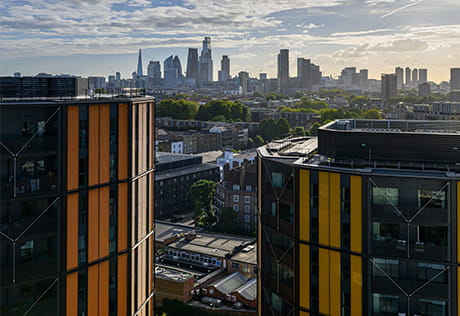 An exterior photograph of Regents View with a skyline of London