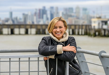 Picture of Lorna infront of the river and the London landscape