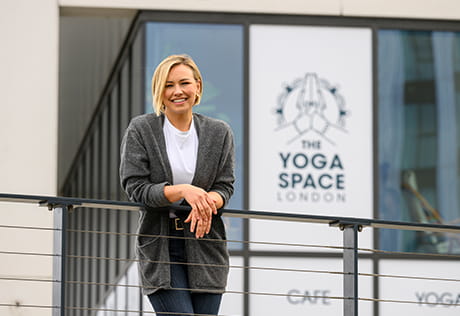 Lorna standing outside the Yoga Space at the Royal Arsenal Riverside development