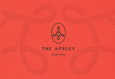 An image of the Asperly logo on a pattern background