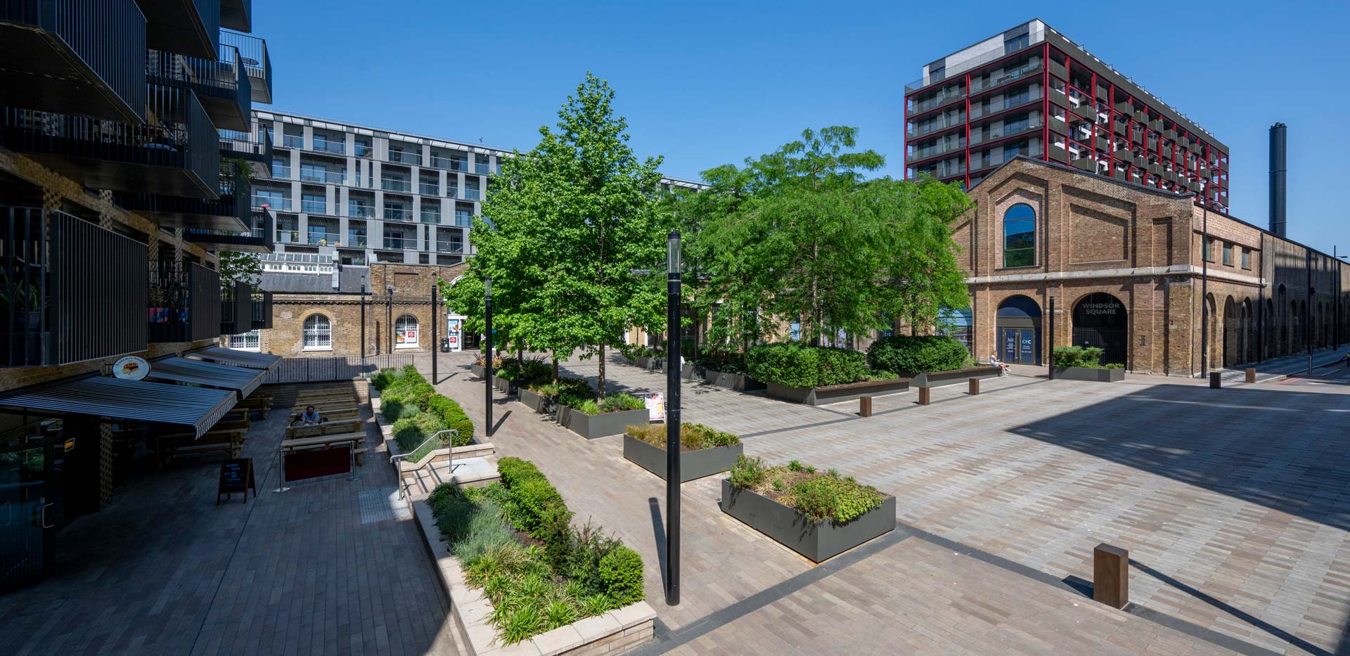 CGI of pedestrian walkways, central courtyard area amongst low rise buildings