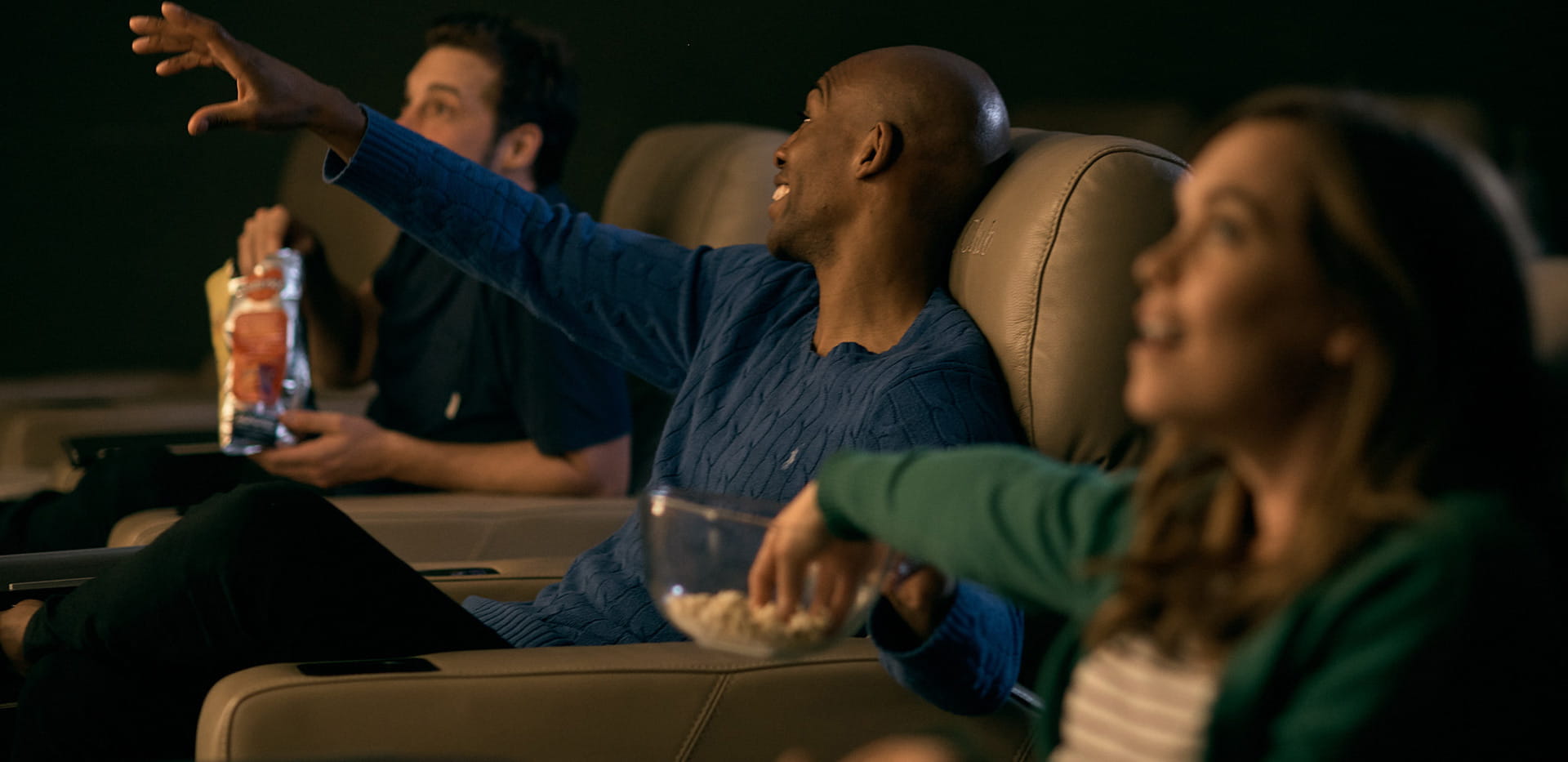 An image of residents using cinema facilities at The Waterside Club 