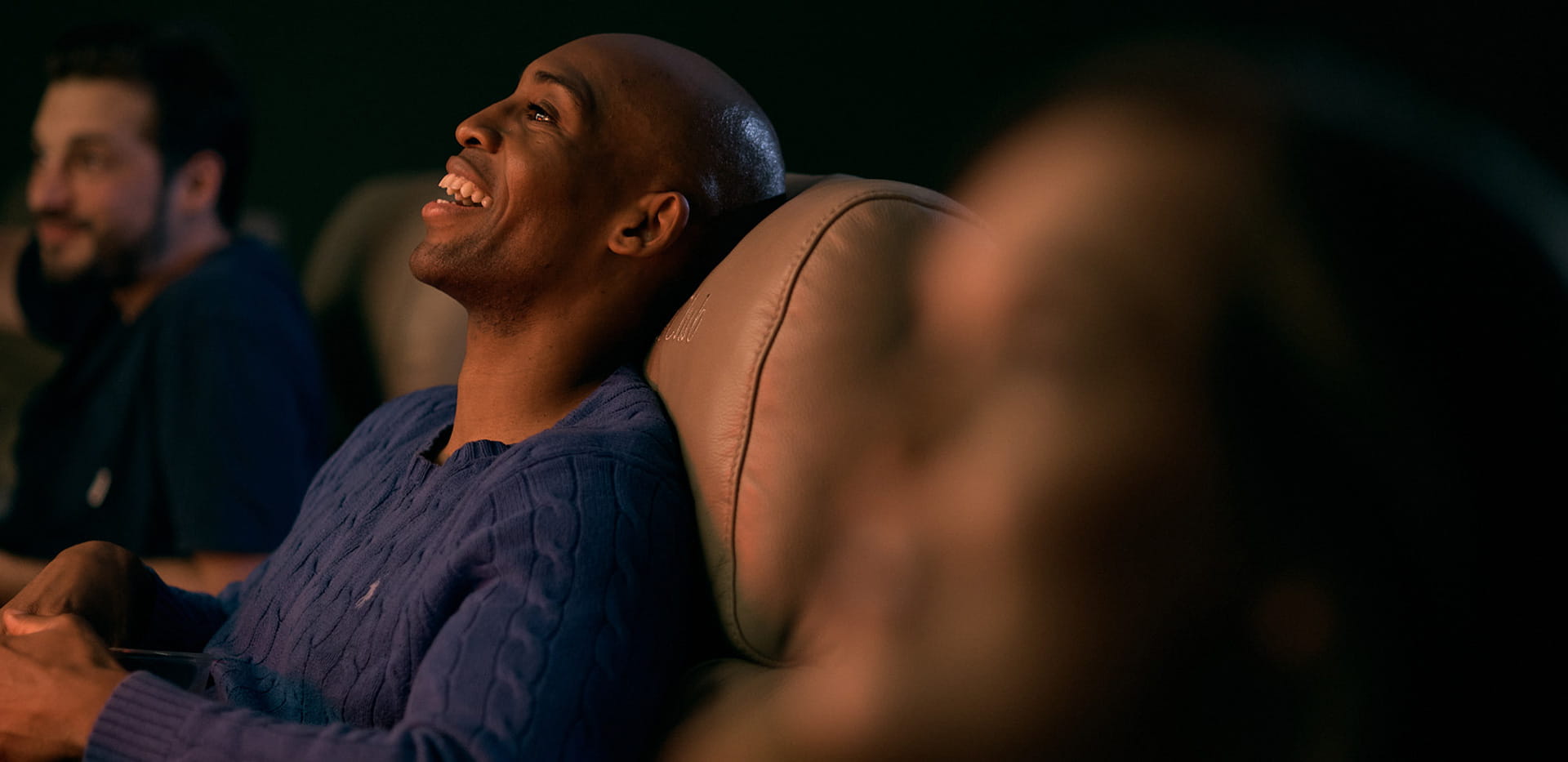 Residents enjoying a movie at The Waterside Club cinema