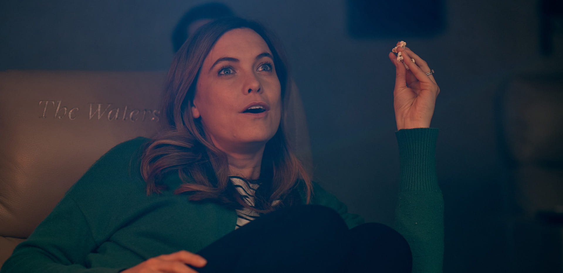 Residents enjoying a movie at The Waterside Club cinema