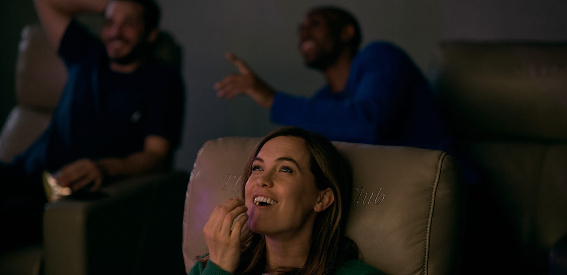 Residents enjoying a movie at The Waterside Club cinema