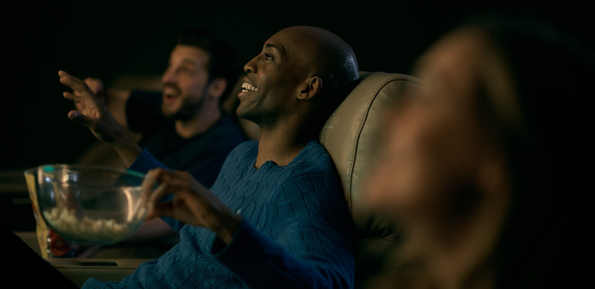 Residents enjoying a movie at The Waterside Club cinema