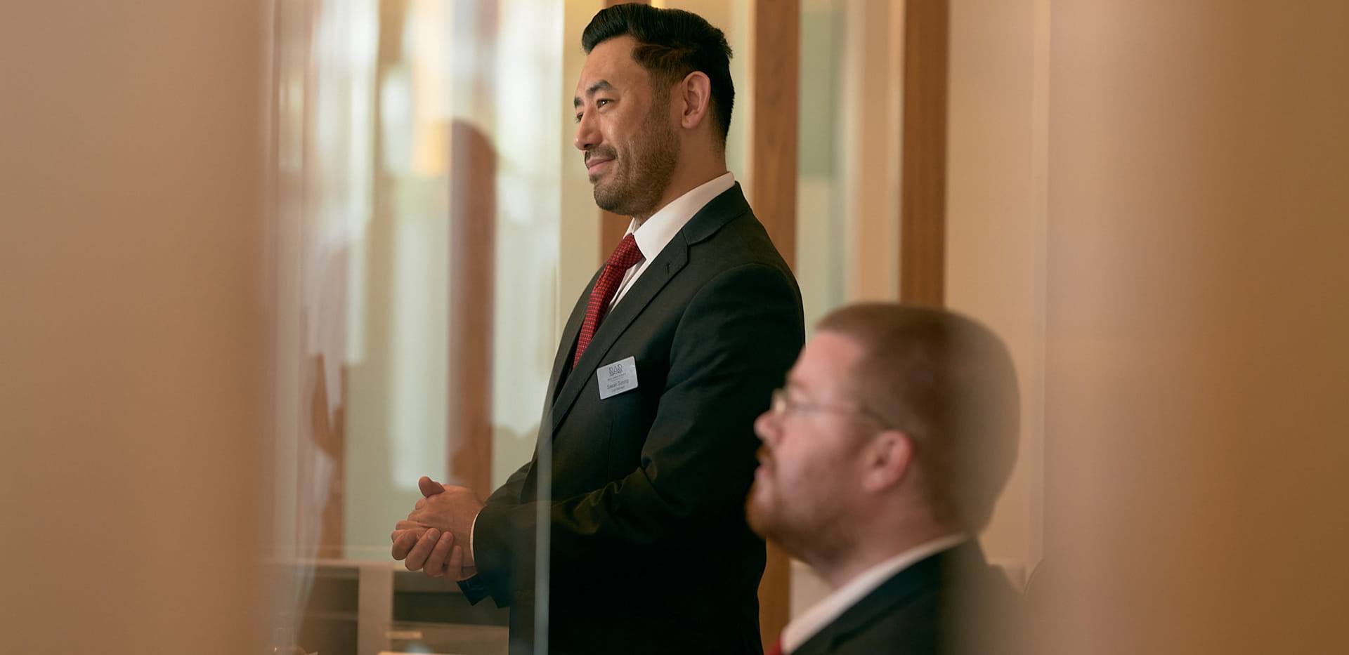 Two male concierge staff having a discussion