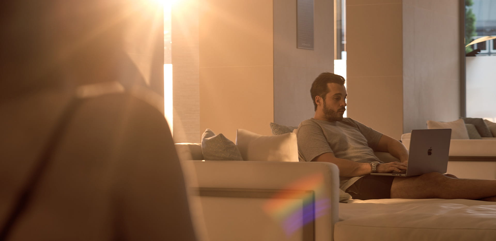 Man enjoying the poolside residents living room