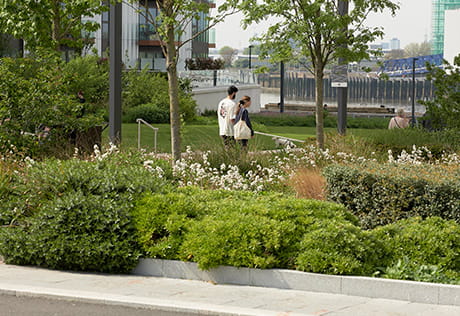 Residents enjoying the open space at Royal Arsenal Riverside