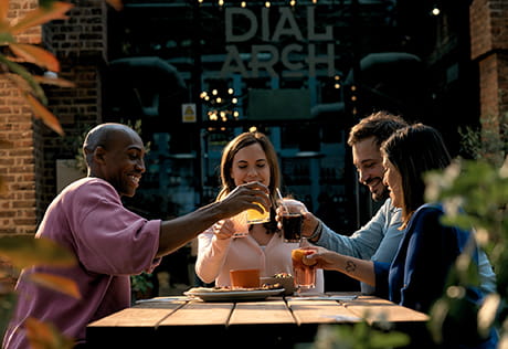 An image of people enjoying a drink outside