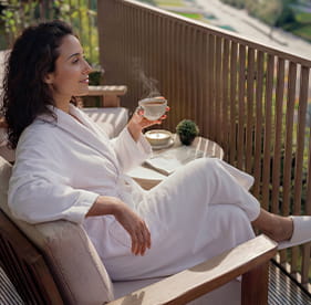 An image of a woman on a balcony at Royal Arsenal Riverside