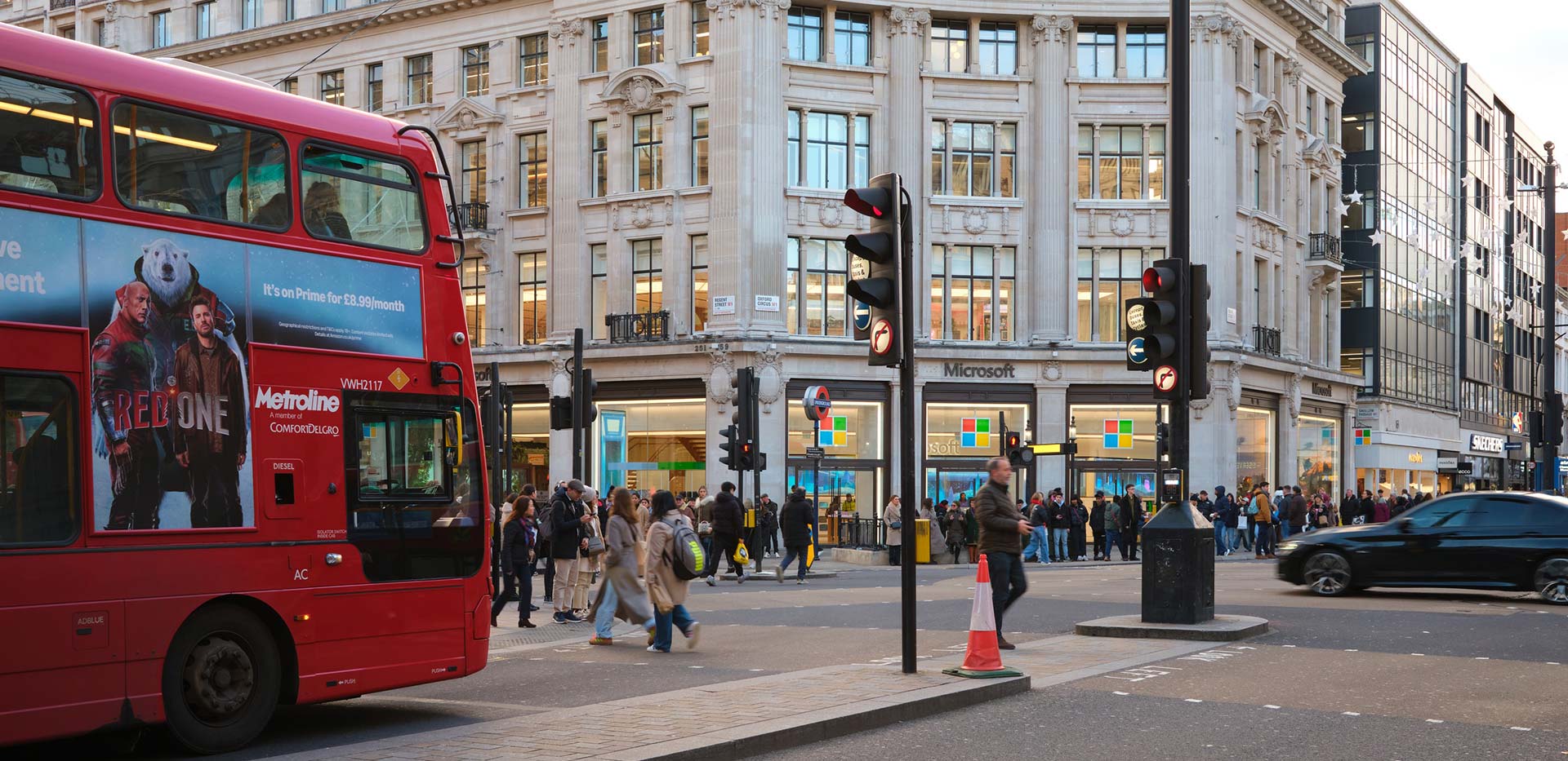Red bus travelling through London
