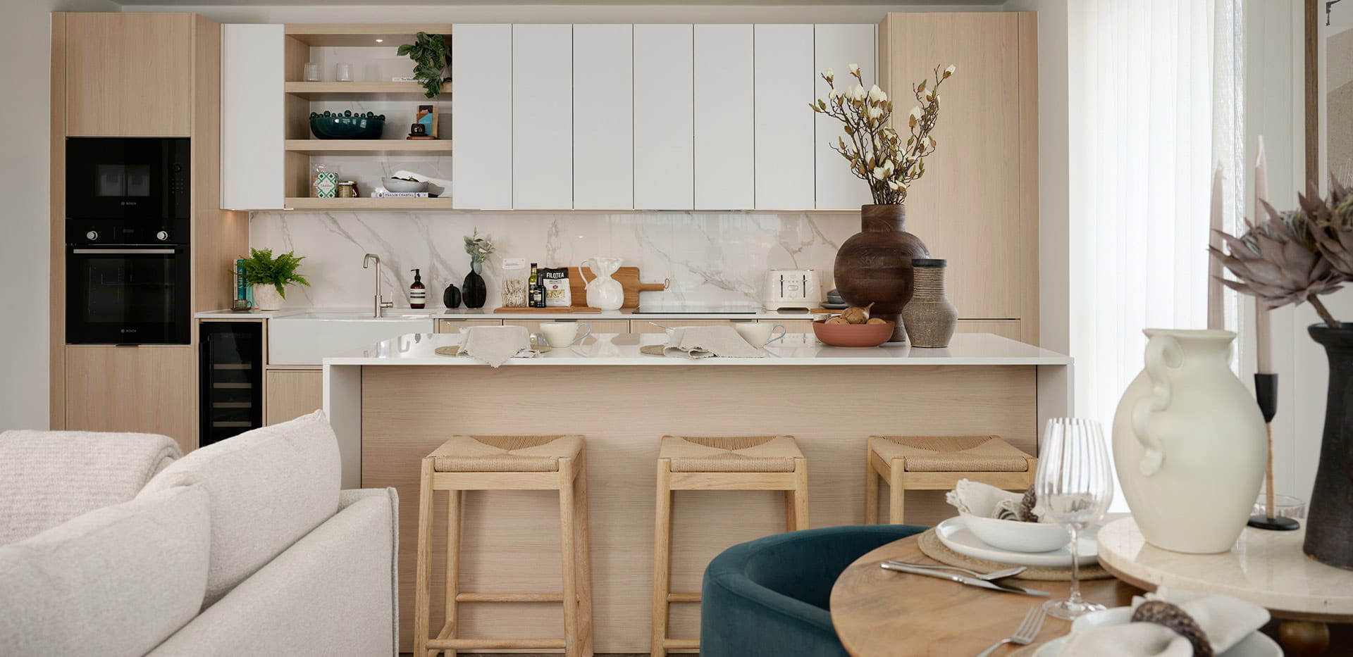 Light design showhome kitchen with breakfast bar
