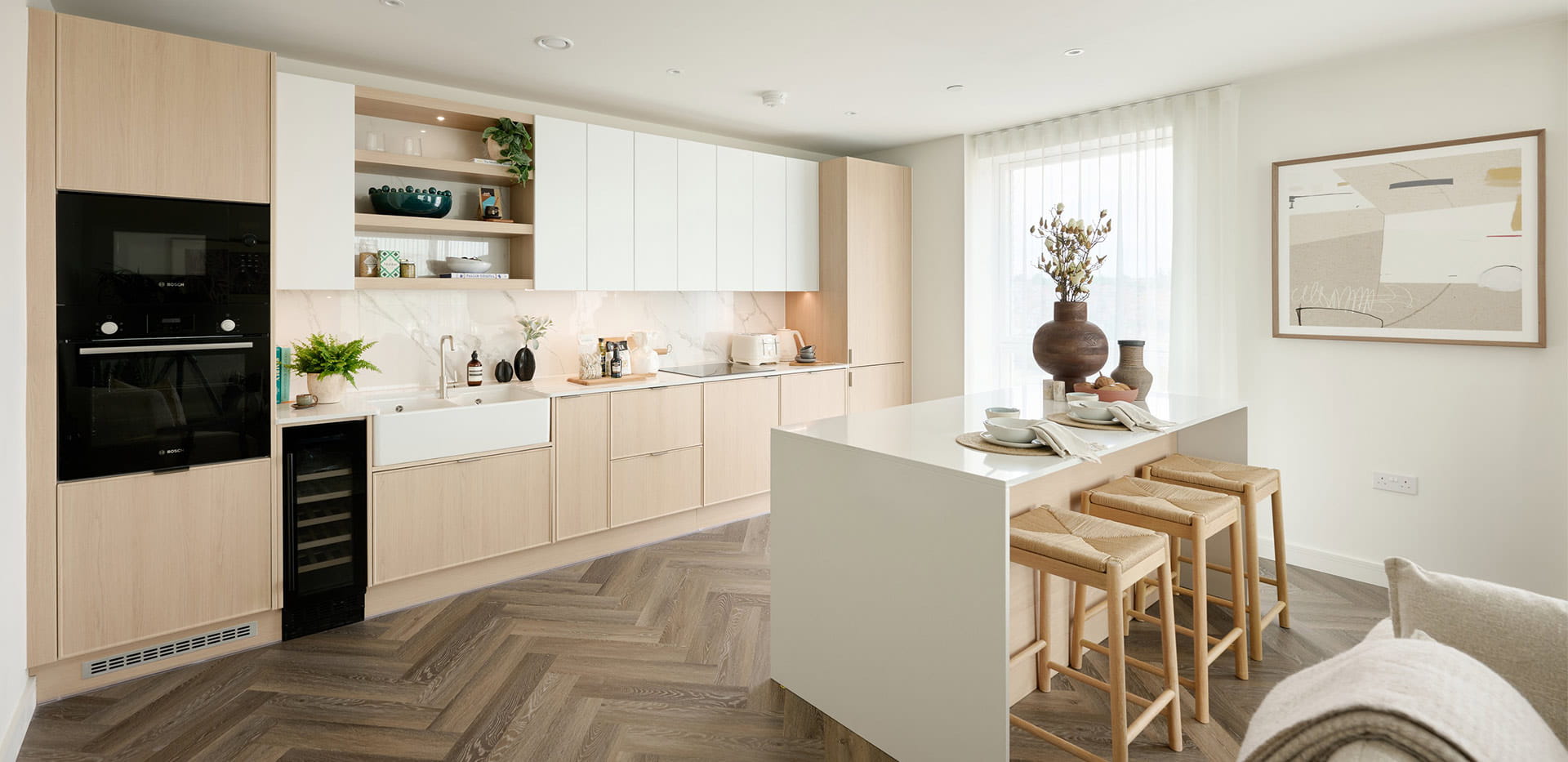 Light design showhome kitchen with breakfast bar