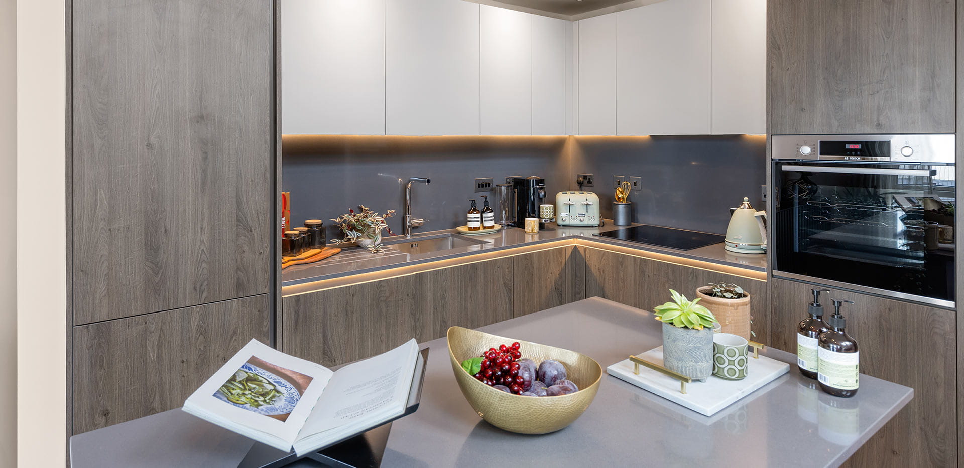 Kitchen area with with island and dark brown design