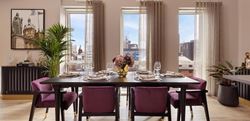 Open dining space with purple seats and large windows looking out onto Snow Hill Wharf