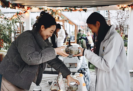 An exchange of goods at a market stall.