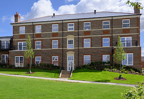 An exterior image of Manor House Apartments at Spring Hill