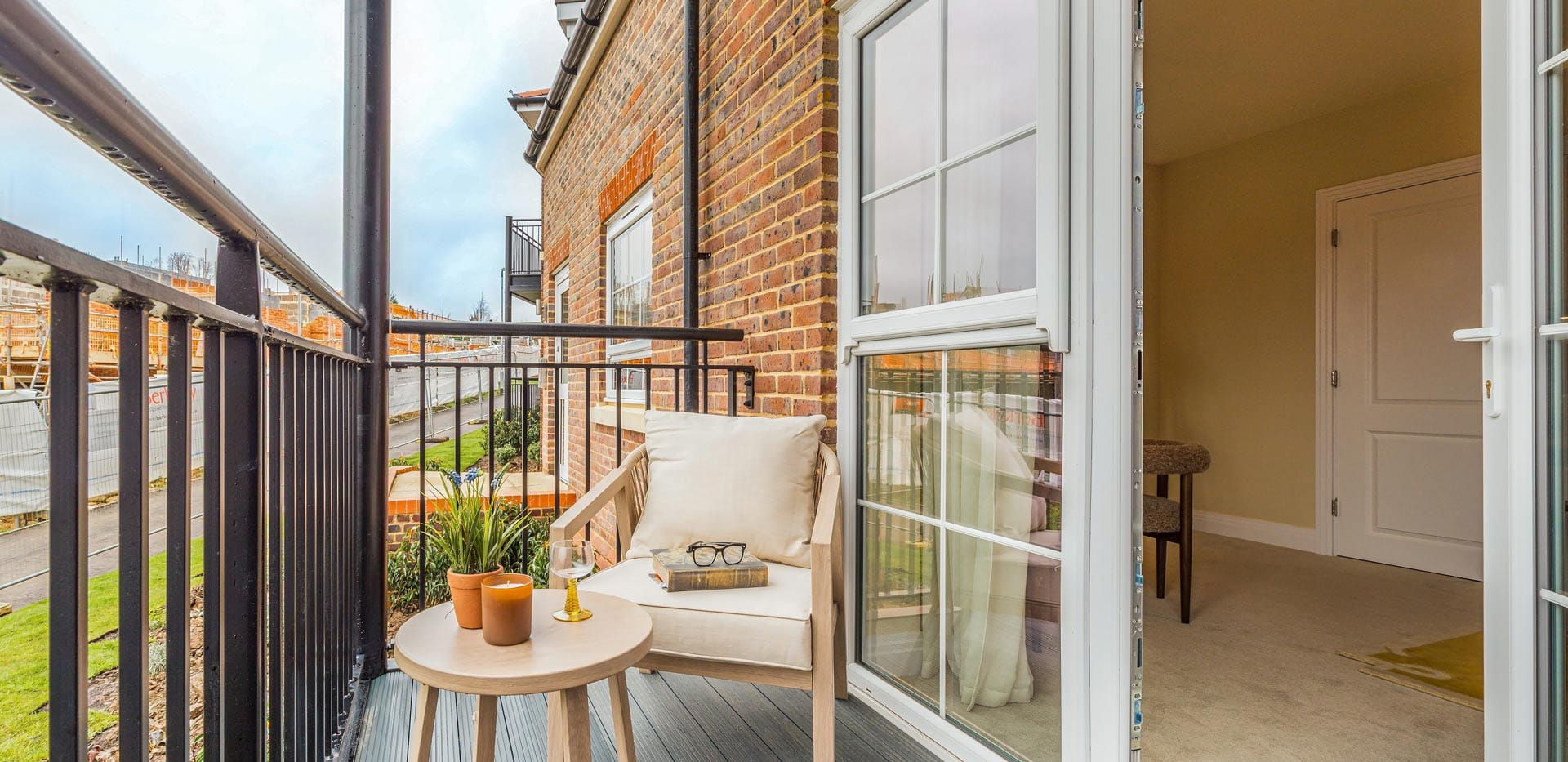Balcony with lounge chair and small coffee table
