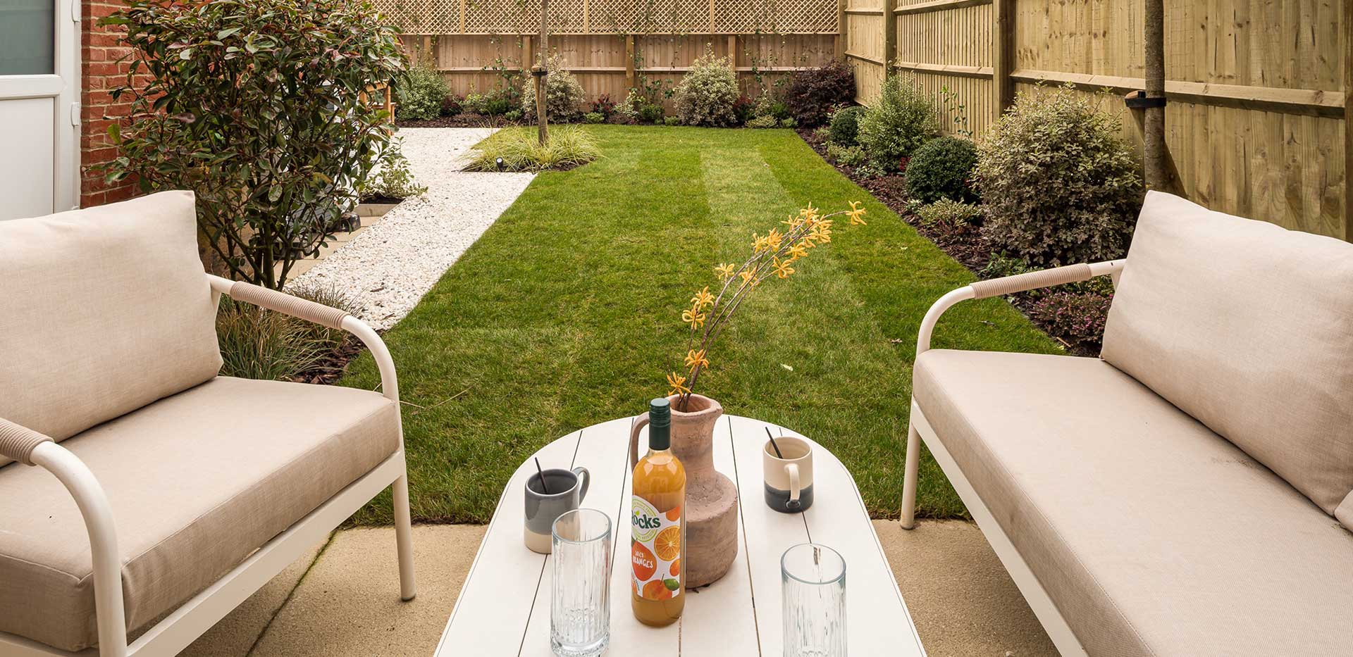 Spring Hill showhome garden with outdoor furniture