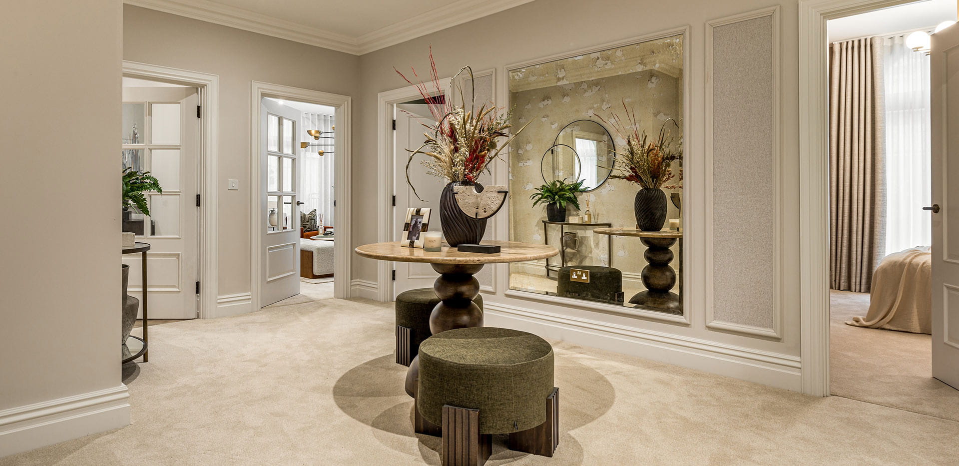 A image of the Hall with a seating area at the 3 Bed Showhome at Sunningdale Park