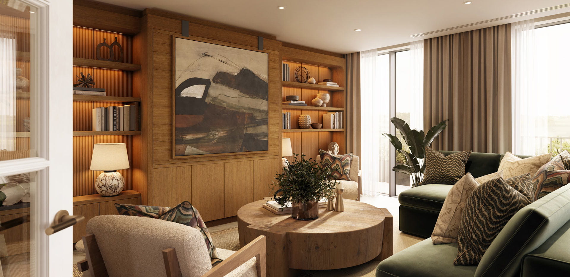 Living space with sofa, armchair, bookshelves and wall hanging