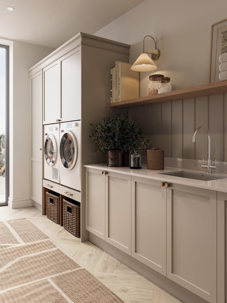 Utility room with washing machines, sink, cupboards and shelving spaces