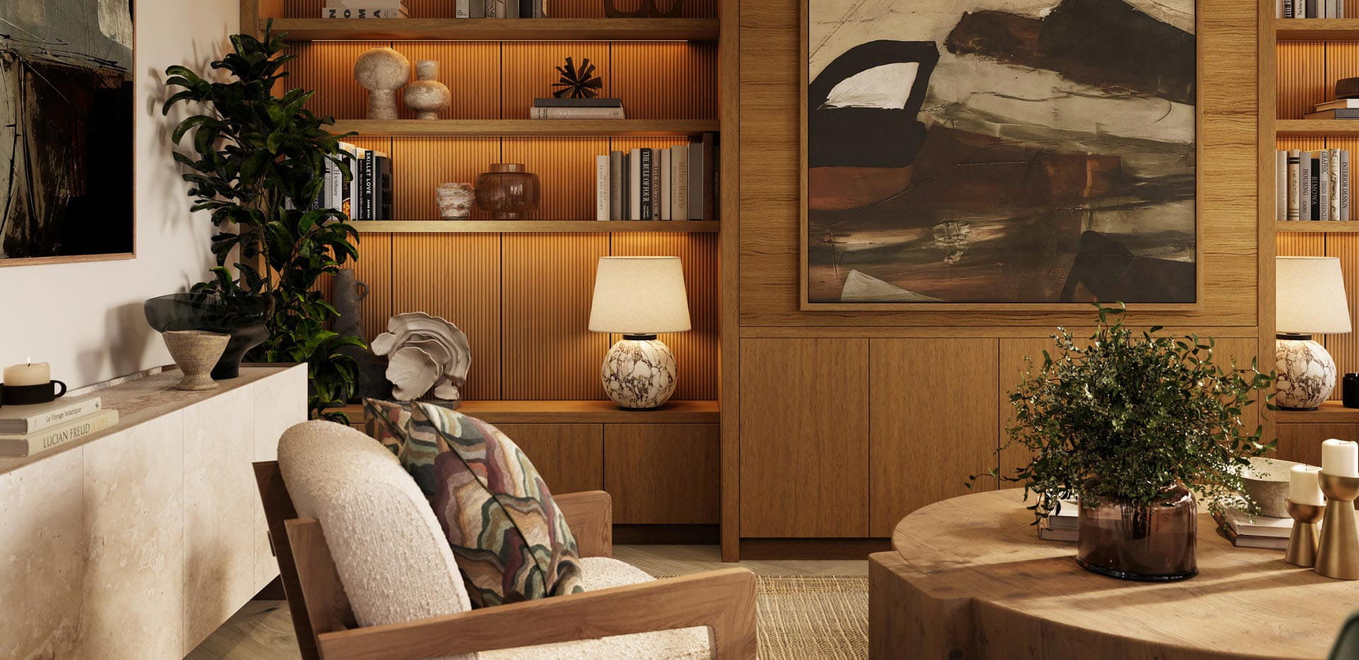 Living space with armchairs, wooden rounded coffee table, bookcase and shelving unit