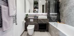 Bathroom with dark marble finish