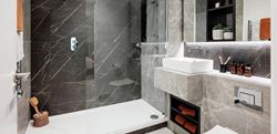 Bathroom with grey and black marble finish