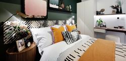 Bedroom with double bed and colourful decor