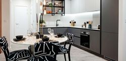 Kitchen and dining area with grey furnishings