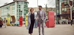 Business man and woman heading towards Watford Junction Station