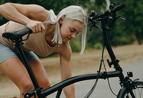An image of a woman with a bicycle